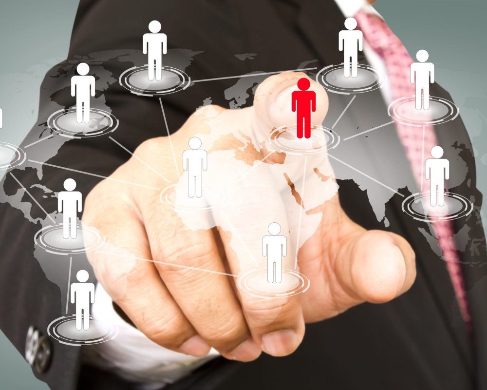 Social Network concept : hand point to social network and world map
